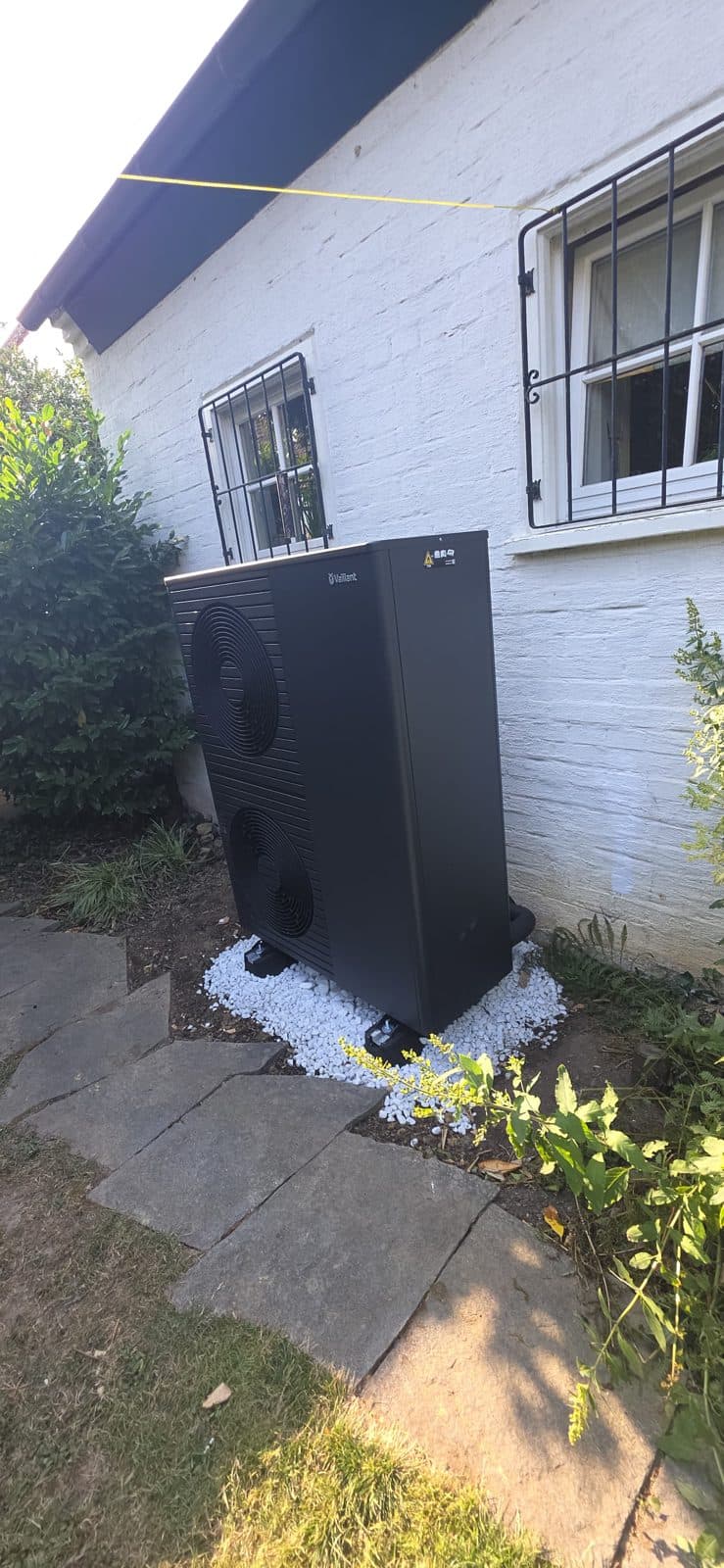 Vaillant heat pump installed in the garden of a house in Riehen, Basel-Stadt